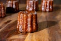 Canele, French pastry flavored with rum and vanilla, soft and tender custard center and dark, caramelized crust specialty of