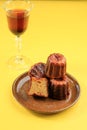 Caneles de Bordeaux - Traditional French Sweet Dessert On Ceramic Plate