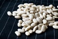 Canellini Navy White Beans on Black Cloth Royalty Free Stock Photo