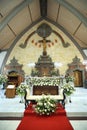 Canggu, Bali Indonesia - September 28, 2023: Balinese Catholic church interior with wedding flowers decoration in white. Bali