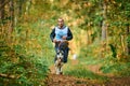 Canicross cross country running with dog, musher running with Siberian Husky dog, sled dog racing