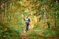 Canicross cross country running with dog, musher running with Siberian Husky dog, sled dog racing