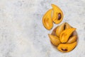 Canistel fruit in wooden bowl with space on cement floor