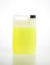 Canister with yellow car shampoo concentrate on a white background, isolate. Cleaning a car from dirt, shampoo for a