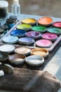 Canisters Of Oil Paints At Carnival Face Painting Station