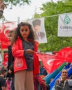 Cankaya, Ankara, Turkey - May 19 2022: Little Turkish girl waving turkish flag