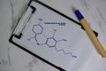 Cannabidiolic Acid molecule write on the paperwork. Structural chemical formula. Education concept