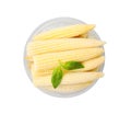 Canned baby corns with basil on white background, top view Royalty Free Stock Photo