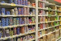 Canned fish on shelves of supermarket store