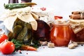 Canned food concept. Fermented, pickled, marinated preserved vegetarian food. Organic vegetables and fruits in jars with spice and Royalty Free Stock Photo