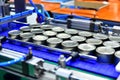 Canned food products on conveyor belt