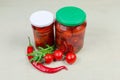 Canned and fresh peppers chili and cherry tomatoes Royalty Free Stock Photo