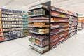 Canned and in glass jar tomato shelves. New supermarket Royalty Free Stock Photo