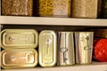 Canned meat food cans stored on kitchen shelf Royalty Free Stock Photo