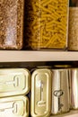Canned meat food cans stored on kitchen shelf Royalty Free Stock Photo