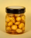 Canned nuts in honey. Home preservation. Royalty Free Stock Photo