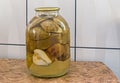 Canned pear in glass jar.