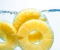 Canned pineapple splash in water Royalty Free Stock Photo