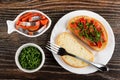 Canned herring - imitation salmon in bowl in shape fish, bowl with parsley, slice of bread, fork, sandwich with herring and