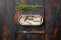 Canned sardine in oil, on old dark  wooden table background, top view flat lay, with copy space for text Royalty Free Stock Photo