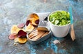 Canned sardines with cassava, plantan, beet and sweet potato chips with cucumber, celery and lettuce salad in eco friendly disposa