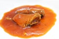 Pile of canned sardines in tomato sauce closeup. Selective focus