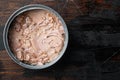 Canned soy free albacore white meat tuna, in tin can, on old dark  wooden table background., top view flat lay Royalty Free Stock Photo