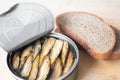 Canned sprats on rye bread served with herb baked potatoes Royalty Free Stock Photo