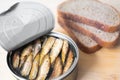 Canned sprats on rye bread served with herb baked potatoes Royalty Free Stock Photo
