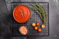Canned Tomato sauce Passata, preserved paste for cookng. black background. top view Royalty Free Stock Photo