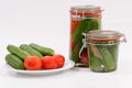 Canned tomatoes and cucumbers in glass jar Royalty Free Stock Photo