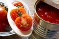 Canned tomatoes and fresh tomatoes Royalty Free Stock Photo