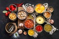 Canned vegetables, beans, fish and fruits in tin cans on black background. Food stocks Royalty Free Stock Photo