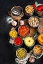 Canned vegetables, beans, fish and fruits in tin cans on black background. Food stocks Royalty Free Stock Photo