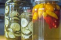 Canned yellow peppers and cucumber in a jar on wooden background,natural light Royalty Free Stock Photo