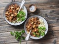 Cannellini beans beef stew with couscous on the wooden table, top view