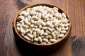 Cannellini beans on wood bowl Royalty Free Stock Photo