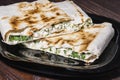 Cannelloni, cottage cheese with greens in pita bread on a plate Royalty Free Stock Photo