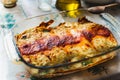 Cannelloni with spinach close up, tomato sauce, bachamel and cheese on table cloth. Traditional homemade classic italian cuisine Royalty Free Stock Photo