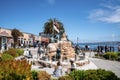 Cannery Row Monument on coastline with sea and blue sky in the background