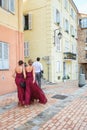 Bridesmaids in beautiful dresses on their way to the Catholic ch