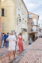 Wedding guests on their way to the Catholic church Notre Dame d `