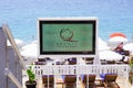 Qualite Tourisme logo brand label and text sign on beach screen on beach state guaranteed