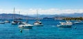 Cannes seafront panorama with Alpes rocky cliffs, port, old town and yacht sailing on waters of Mediterranean Sea in France