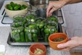 Canning cucumbers at home. Pickles jars for winter season. Organic homemade cucumber pickles