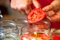 Canning fresh tomatoes with onions in jelly marinade.