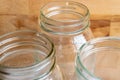 Canning jars against wood background Royalty Free Stock Photo