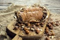 Cannoli, deep fried Italian pastry tubes with a sweet ricotta cheese, chocolate chips and hazelnuts served on a wooden board Royalty Free Stock Photo