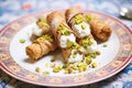 cannoli with pistachio nuts topping, macro detail Royalty Free Stock Photo