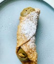 Cannolo with pistachios, Sicilian dessert with pistachio cream, Italian dessert based on ricotta and pistachios, shortcake with cr Royalty Free Stock Photo